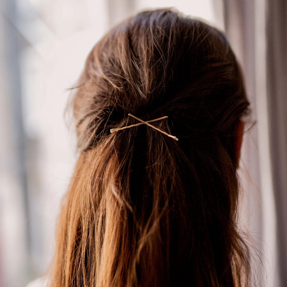 Bachca Gold Bobby Pins holding brunette hair