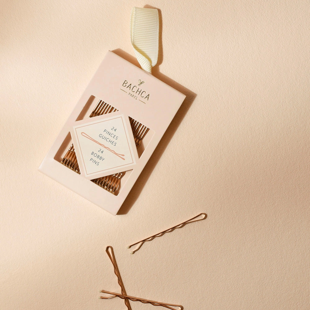 Bachca Gold Bobby Pins in packing and scattered