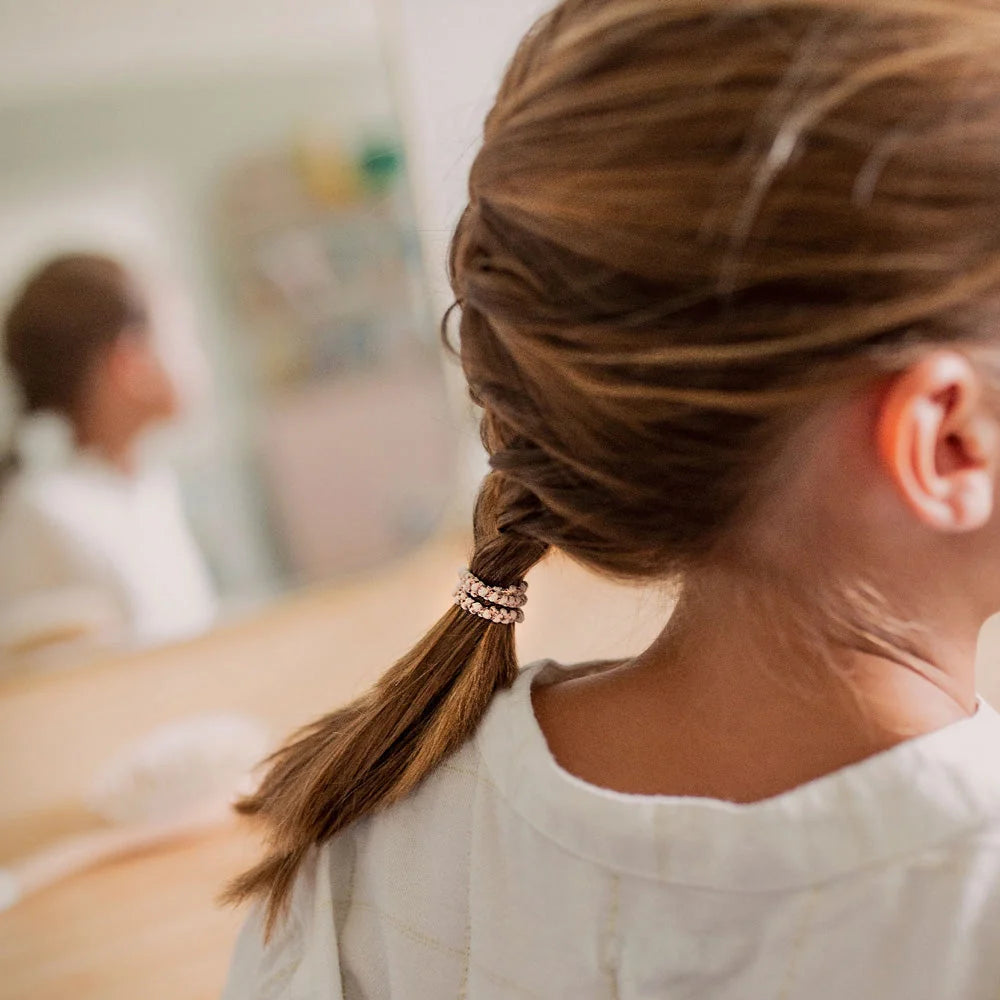 Thin Hair tie holding braid