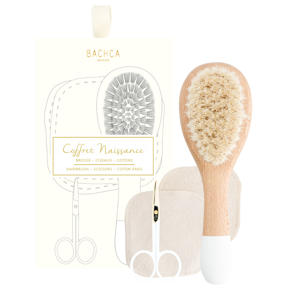 Baby grooming set with brush, comb, and cotton pads from Bacha on a white background