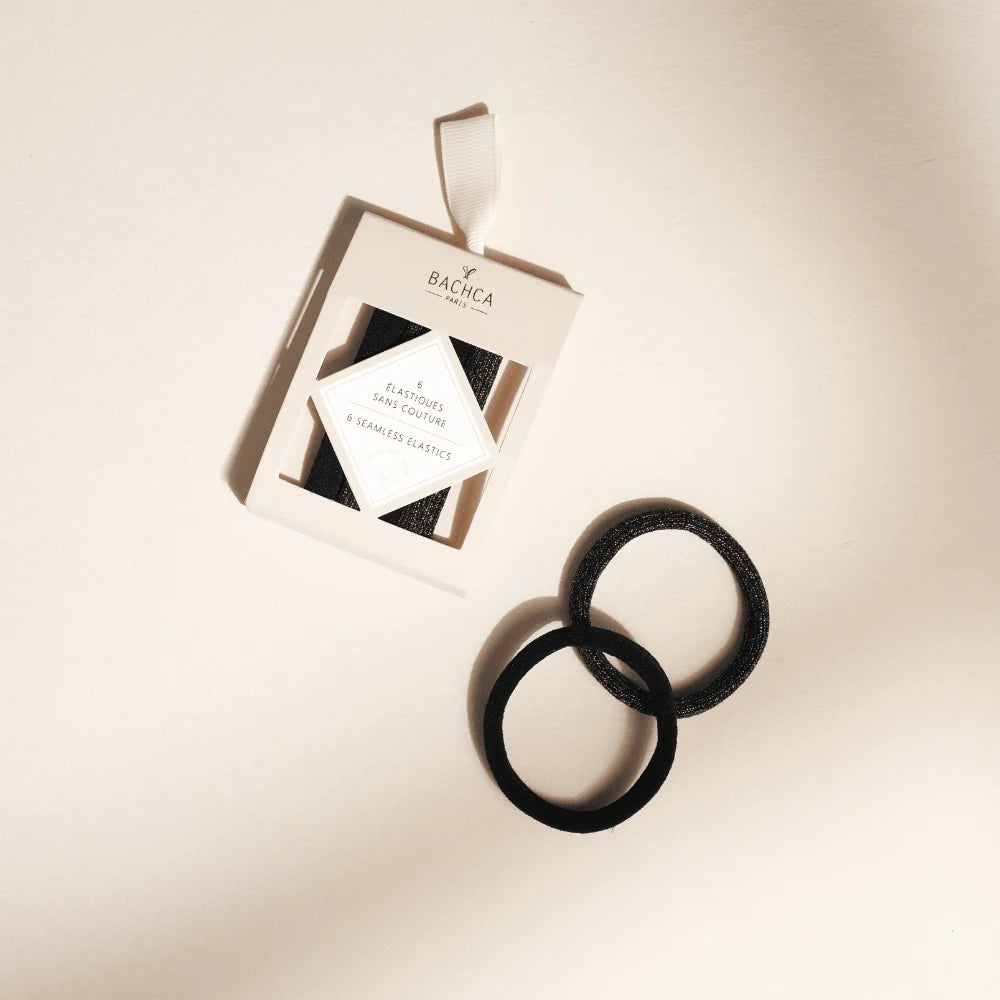 Bo√Æte Bachca contenant six √©lastiques noirs sans couture, avec deux √©lastiques pr√©sent√©s √† c√¥t√© sur fond beige.