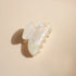 Bachca Pearl Claw Clip in classic size on beige background 