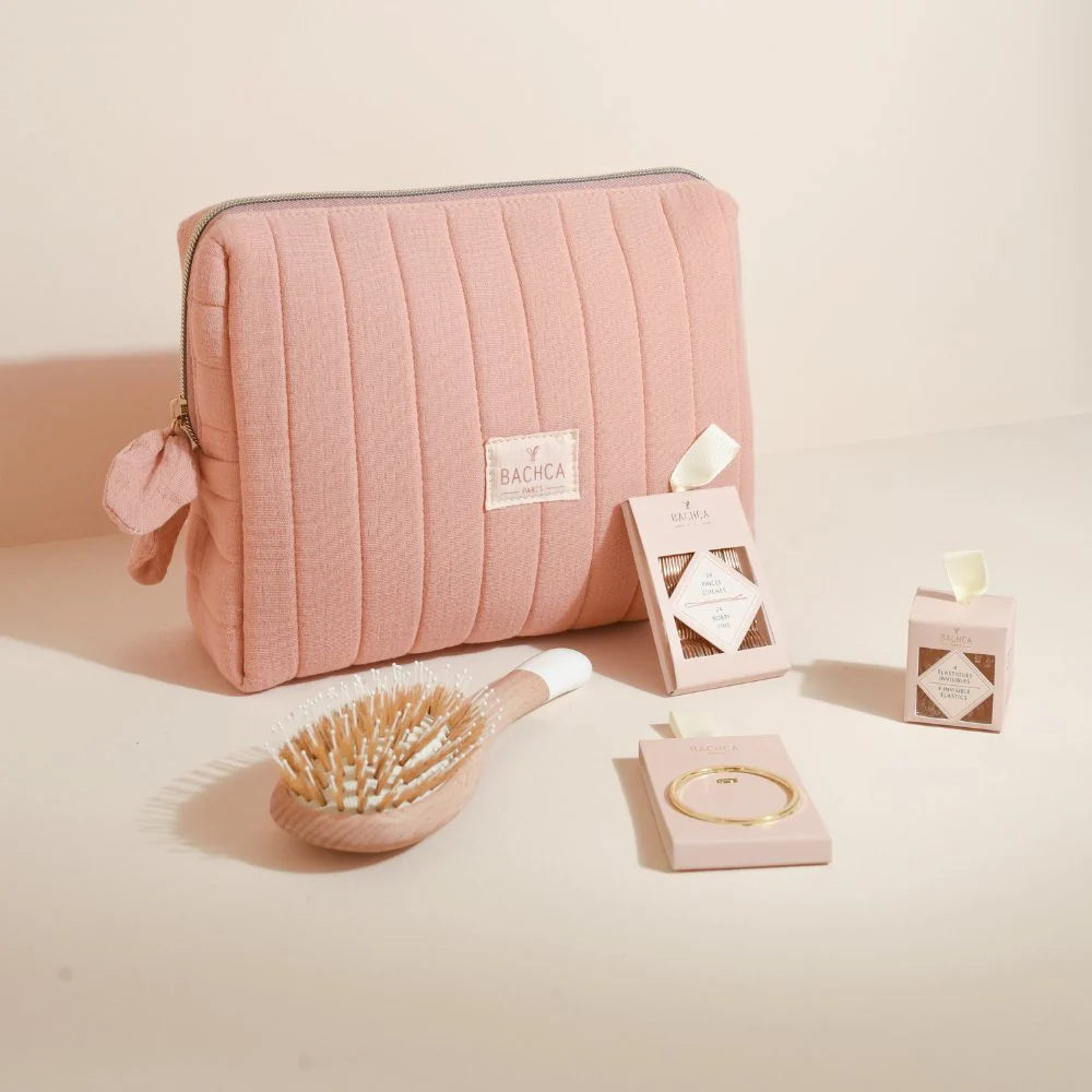 Bachca Pink Bag and Matching Accessories: wooden hairbrush, bobby pins, hair elastics, and round hair clip.